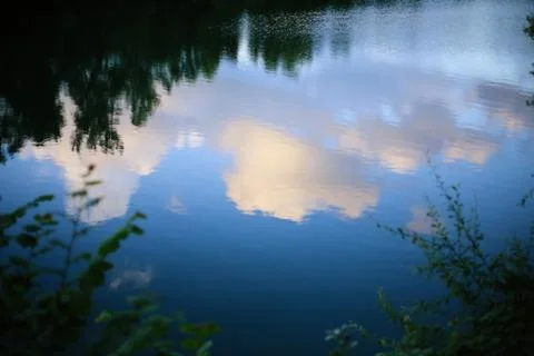 Reflection of clouds in the lake. Stock Photos
