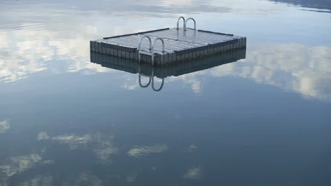 Reflection of clouds on Lake Wakatipu with floating pontoon Stock Footage 119160049