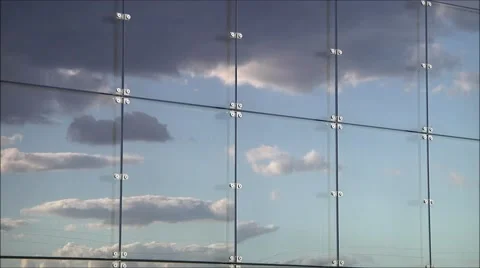 Reflection of clouds in modern building window timelapse.1080p. N096 16x.mp4 Stock Footage 43066751