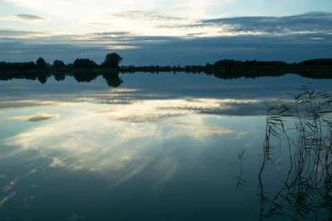 The reflection of clouds in the surface of the lake Stock Photos