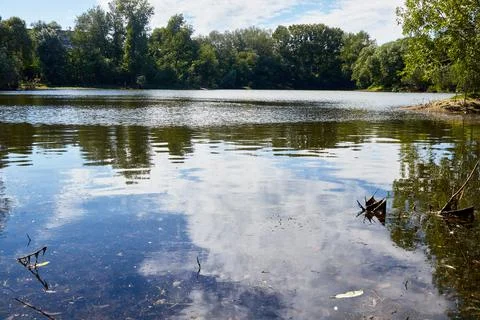 Reflection of clouds in the water of lake Stock Photos