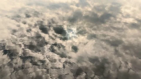 Reflection of clouds on water surface creating soft mirror effect, Stock Footage 338243644