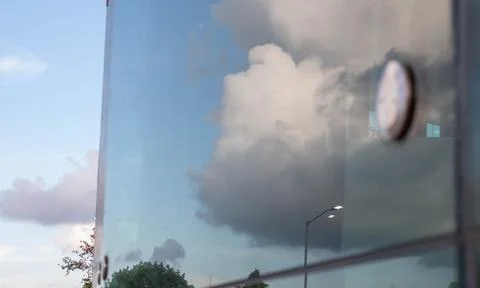 Reflection of clouds in window glass in the summer Stock Photos