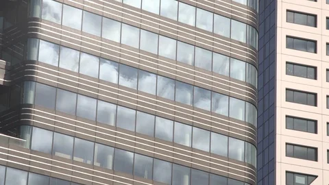 Reflection of clouds in windows office building Stock Footage 102546289
