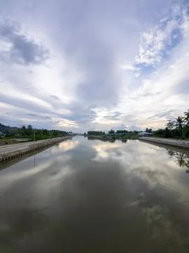 Reflection of Cloudy Sky on Canal Fotos Stock