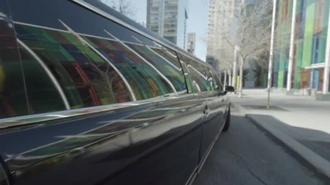 Reflection of colored glass on moving limousine window 스톡 동영상 167671888