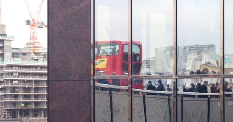 Reflection of commuters on London Bridge Reflection Slow motion 4k Stock Footage 94712839