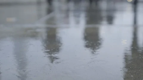 Reflection of commuters walking in the rain at rush hour Video stock 118258257