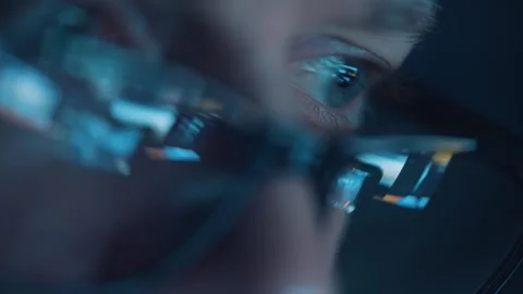 Reflection of computer screen in man's glasses Stock Footage 336740888