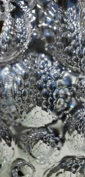 Reflection on convex polygon surface glass.Riffled glass texture. Background. Stock Photos