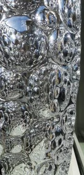 Reflection on convex polygon surface glass.Riffled glass texture. Background. Stock Photos