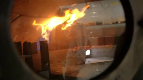 Reflection of the cook while the pizza is baked in the oven Stock Footage 85007484