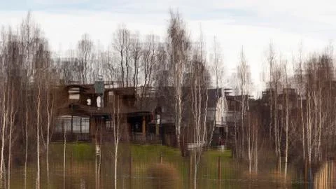 Reflection of cottages and trees Stock Photos