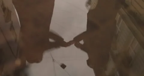Reflection of a couple in love in a puddle of rainwater on the asphalt Video stock 247487172