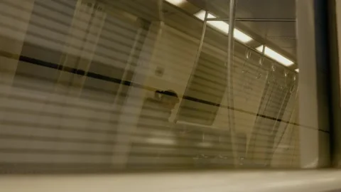 Reflection creates abstract patterns in a subway window during travel Stock Footage 313618830