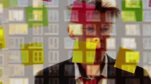 Reflection of a creative businessman putting post it notes on to a window Stock Footage 80174400