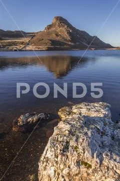 Reflection in Cregennan Lakes, Snowdonia, Wales Stock Photos