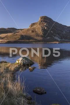 Reflection in Cregennan Lakes, Snowdonia, Wales Stock Photos