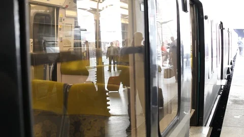 Reflection of crowd of people commuters in the window of metro train Stock Footage 96139020