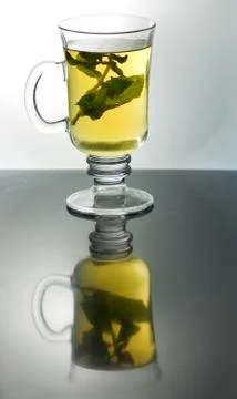 Reflection of cup of mint tea Stock Photos