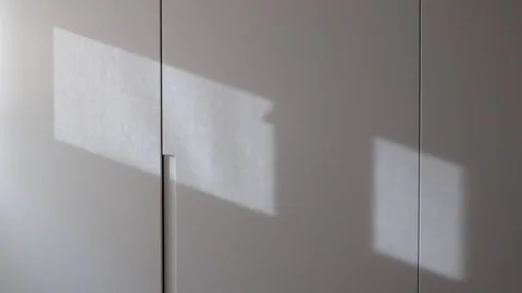 Reflection of curtain cord on the wall. Shadow in movement concept Stock Footage 126390630