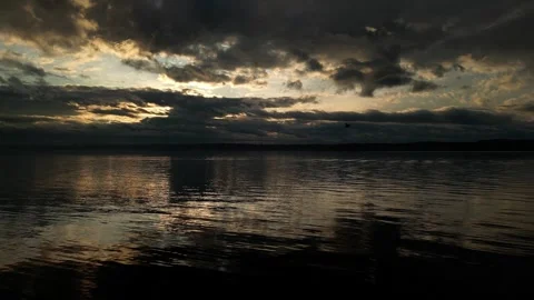 Reflection of dark sunrise on water Stock-Footage 294707676
