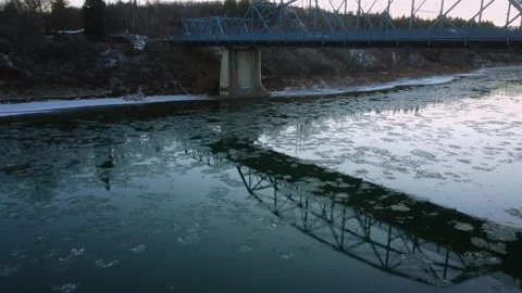 Reflection of the Dawson Bridge &amp; River Ice Stock Footage 322118864