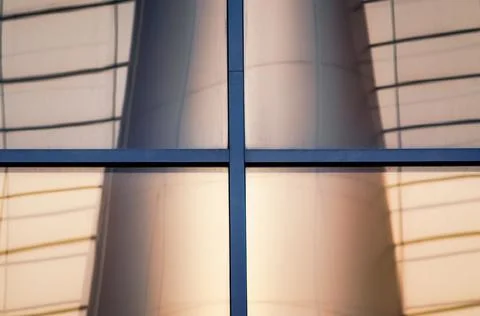 Reflection with distortion in the window of a modern building Stock Photos