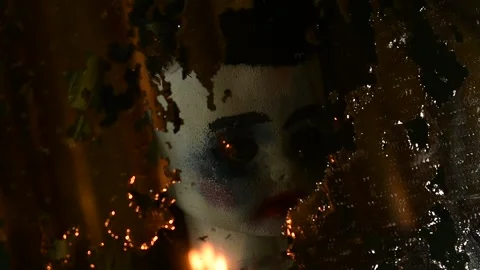 Reflection of a doll in an old mirror in the light of a flame Stock Footage 135387941