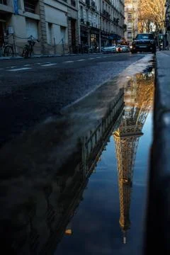 A reflection of the Eiffel Tower on a sidewalk in Paris, France. Foto stock