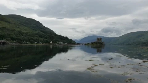 Reflection of Eilean Donan Castle, Scotland, UK in Loch Duich Stock Footage 135066377