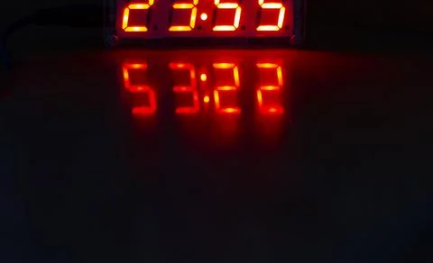 Reflection of an electronic clock Foto stock