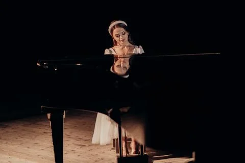 Reflection of Elegance at the Piano Stock Photos