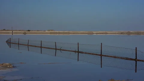 Reflection on an evaporation pond, Dead Sea Israel/Palestine Stock Footage 230106181