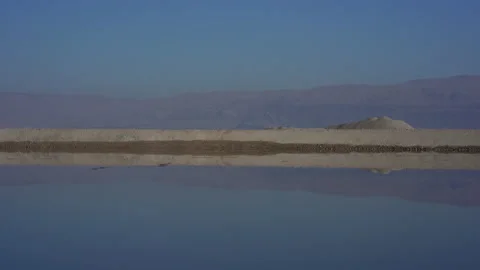 Reflection on an evaporation pond, Dead Sea Israel/Palestine Stock Footage 230106310