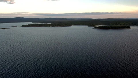 Reflection of evening clouds on the sea surface. The span of the drone above the Stock-Footage 104632448