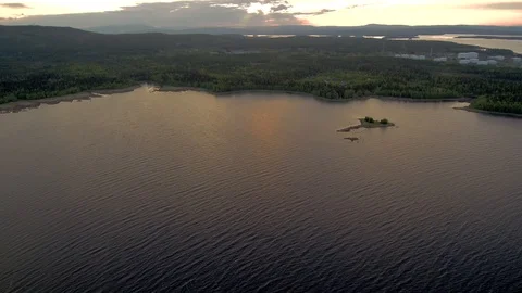 Reflection of evening clouds on the sea surface. The span of the drone above the Stock Footage 104632772