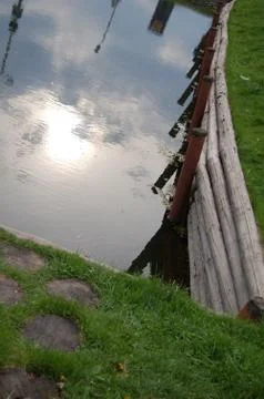 The reflection of the evening sun in the pond Foto stock