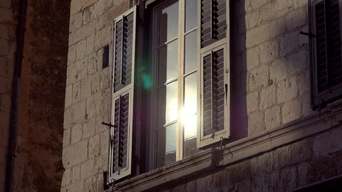 Reflection Of The Evening Sun In The Window With Opened Shutters Stock Footage 98772038