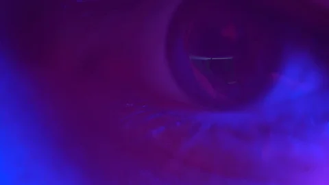Reflection in the eye. Eye of a programmer, a young computer programmer Stock Footage 124360800
