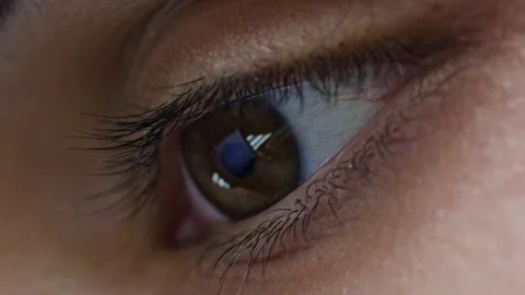 Reflection in the eyes of light from the screen. Fast running news feed. A huge Stock Footage 146167078