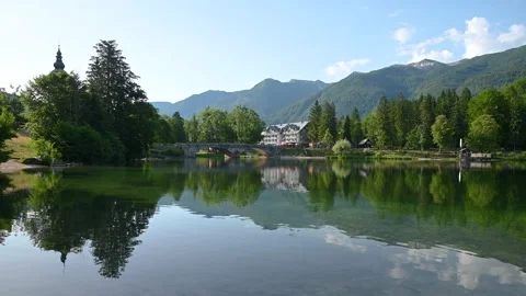 Reflection of famous stone bridge, lake Bohinj, Slovenia Stock Footage 157104602