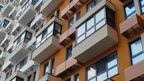 Reflection of flying clouds in the windows of an apartment building. Timelapse Stock Footage 223126868