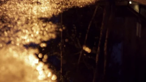 Reflection of glare in a puddle and asphalt Stock Footage 71336659