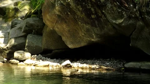 Reflection glare from water to stone Stock Footage 68807353