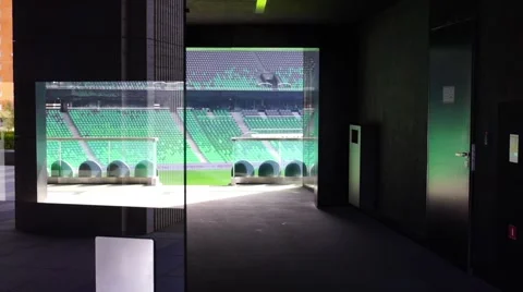 Reflection in the glass doors at the stadium Stock Footage 68858936