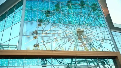 Reflection in the glass of the Ferris wheel Stock Footage 93414300