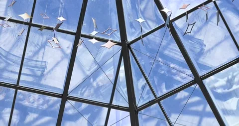 Reflection in the glass of a shopping center interior with visitors Stock Footage 344178114
