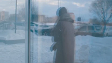 Reflection in the glass showcase silhouette of a sad girl Stock Footage 101346041