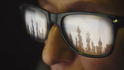 In the reflection of glasses on a female face there is a search page on the Stock Footage 269142970